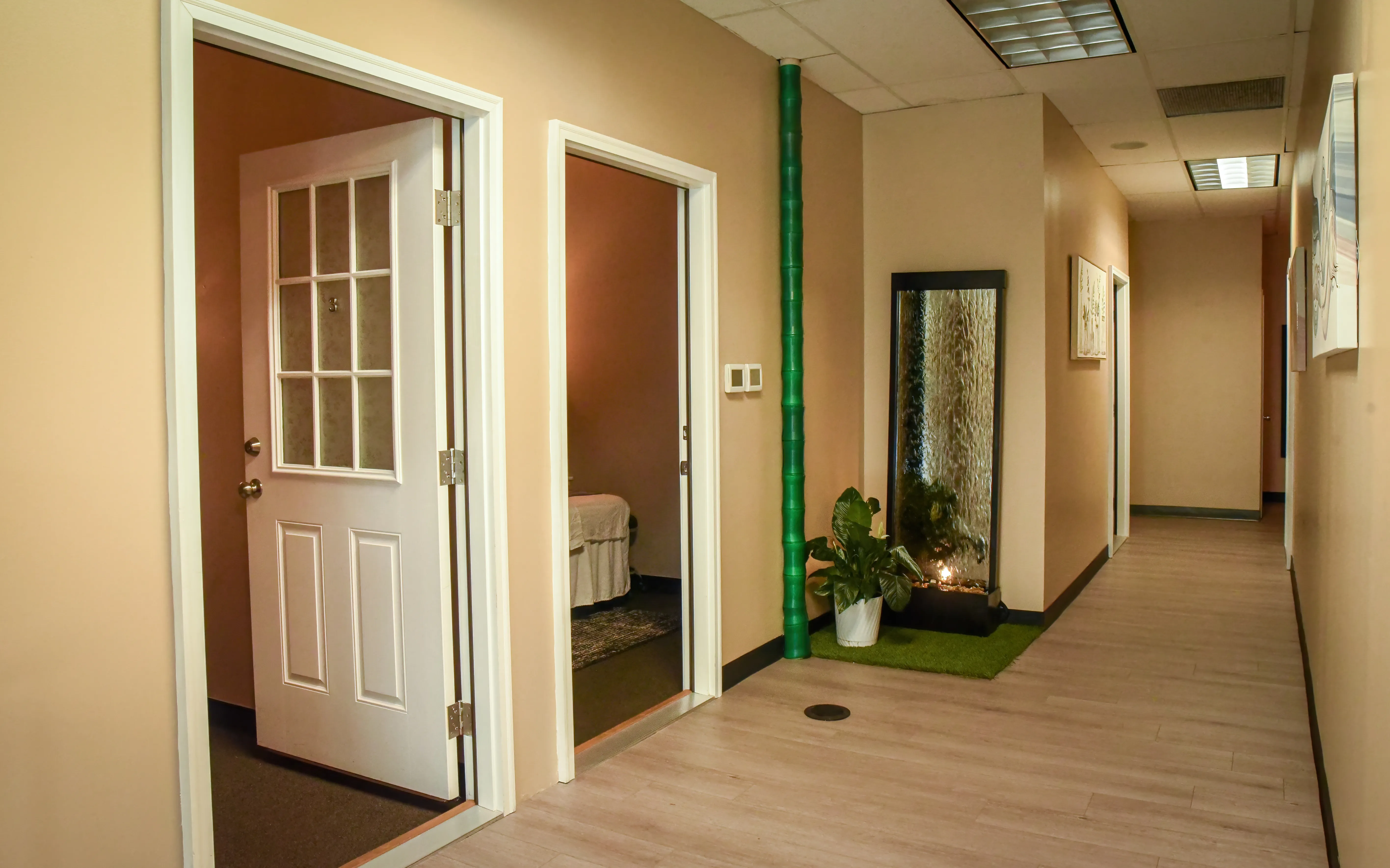 Hallway leading to the private massage treatment rooms at Tina Spa